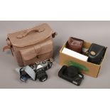 A collection of photographic equipment to include Praktica MTL 50 35mm camera, flash heads etc.