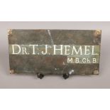 A bronze doctors wall plaque.