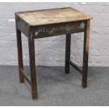 A vintage school desk for restoration.