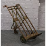 A vintage platform luggage trolley.