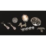 Six silver and white metal brooches to include cameo, marcasite dog example, along with a pair of