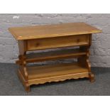 A light oak side table with single drawer.