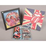 Rolling Stones ephemera The First Decade CD box set, framed still life picture disc and a canvas