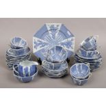 A Japanese transfer printed porcelain tea service with alternating blue and white panels, comprising