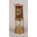 A Welsh copper and brass miners safety lamp by E. Thomas and Williams Ltd.