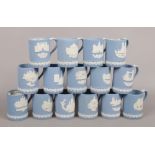 A collection of 15 Wedgwood Jasperware Christmas mugs with view of London.