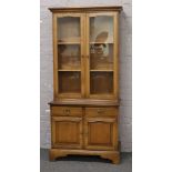 A mahogany bookcase over cupboard base.