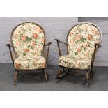 An Ercol spindle back rocking arm chair along with Ercol spindle back arm chair with floral seat and