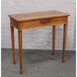 A Jaycee bur walnut metamorphic side table / writing desk with fitted interior and leather inlay,