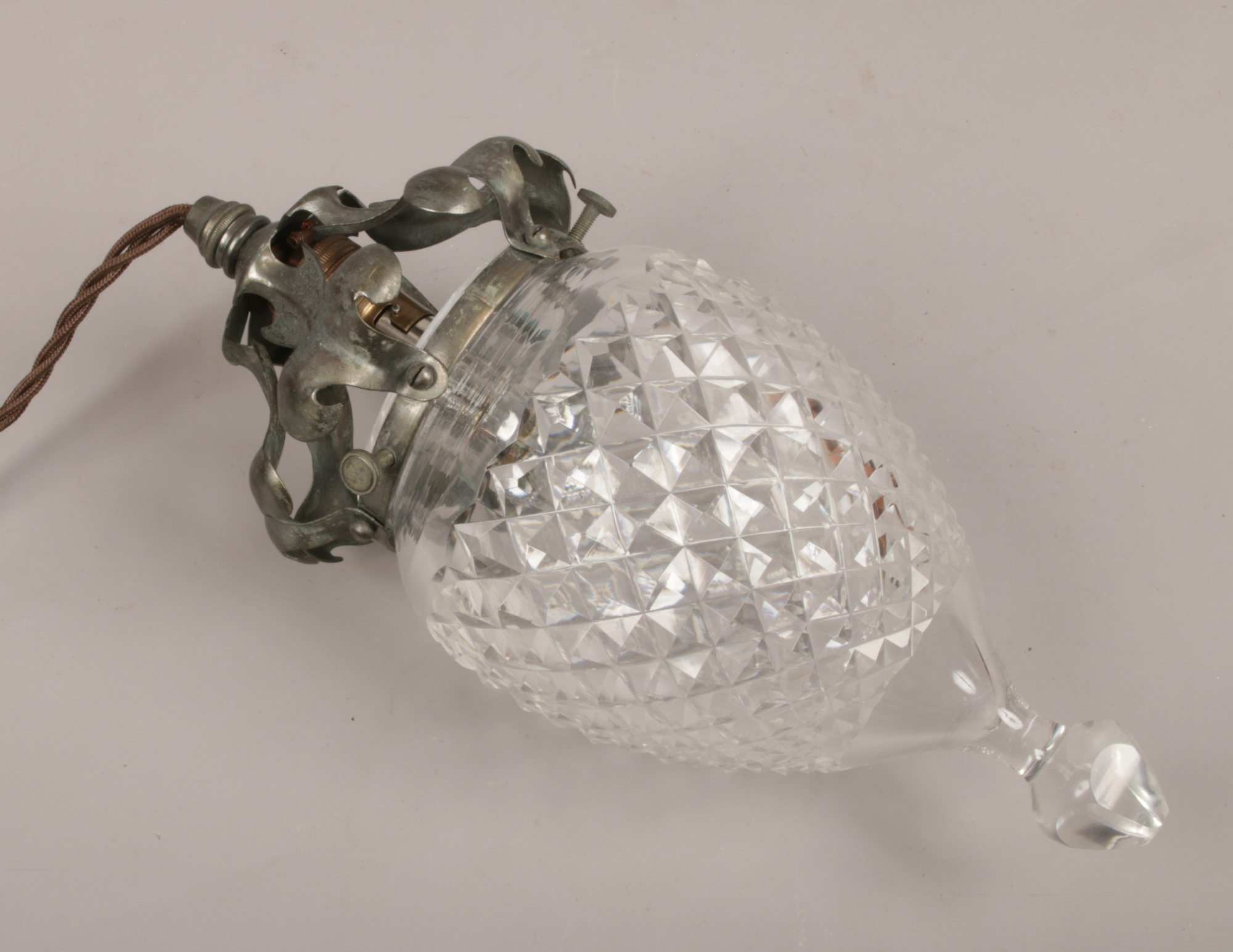 An Arts and Crafts metal mounted cut glass hanging pendant light.Condition report intended as a