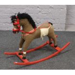 A vintage child's rocking horse.