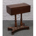 A Victorian mahogany workbox raised on double pedestal base.