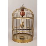 An antique hanging brass bird cage.