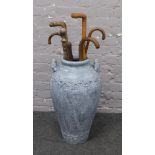 A large blue twin handle urn and seven walking sticks to include Deputies yard stick.