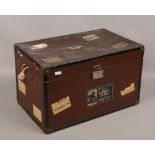 A small decorative vintage travel trunk with framed labels, 47cm wide.