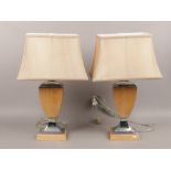 A pair of wood and chrome table lamps, height 66cm.