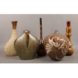 A group of large decorative vases to include pottery, glass and wooden examples.