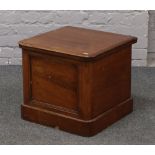 A 19th century mahogany commode with liner.