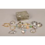A decorative white metal jewellery box and contents of costume jewellery and various wristwatches.
