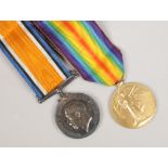 Two British First World War medals on ribbons, Victory medal and The British War Medal both