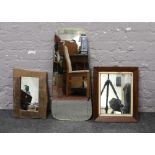 Three decorative wall mirrors to include brass framed, mahogany framed and a rustic example.