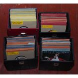 Four carry cases of single records to include Stevie Wonder, Wings, The Drifters etc.