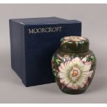 A boxed Moorcroft ginger jar and cover, green ground and decorated in the Gustavia design, Moorcroft