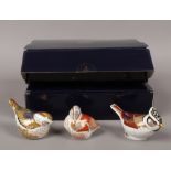 Three Royal Crown Derby collectors guild paperweights, teal duckling, firecrest and crested tit, all