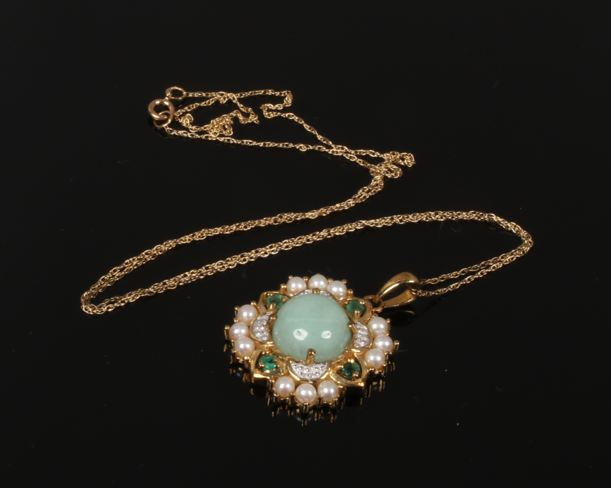 A 9ct gold pendant and chain set with jadeite cabochon centre stone surrounded by seed pearls and