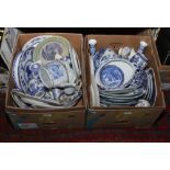 Two boxes of blue and white ceramics to include teawares, dinnerwares, candlesticks etc.