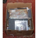 A box of stamps to include album of stamps from around the world, large quantity of loose stamps