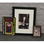 A quantity of The Beatles memorabilia including two framed photographs, along with a metal wall