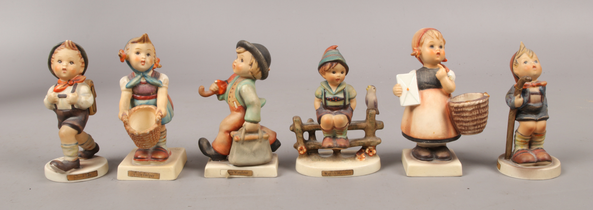 Six M. J. Hummel Goebel figures.Condition report intended as a guide only.Most damaged.