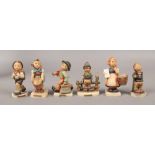 Six M. J. Hummel Goebel figures.Condition report intended as a guide only.Most damaged.