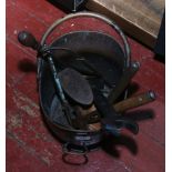 A painted metal and brass coal scuttle and contents of metalwares including shoe last, hand tools