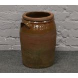 A glazed terracotta two handled vessel, H 47cm x W 35cm.