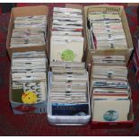 Six boxes of single records, mainly pop.