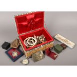 A tub of costume jewellery to include beads, chain, earrings and quartz pocket watch.