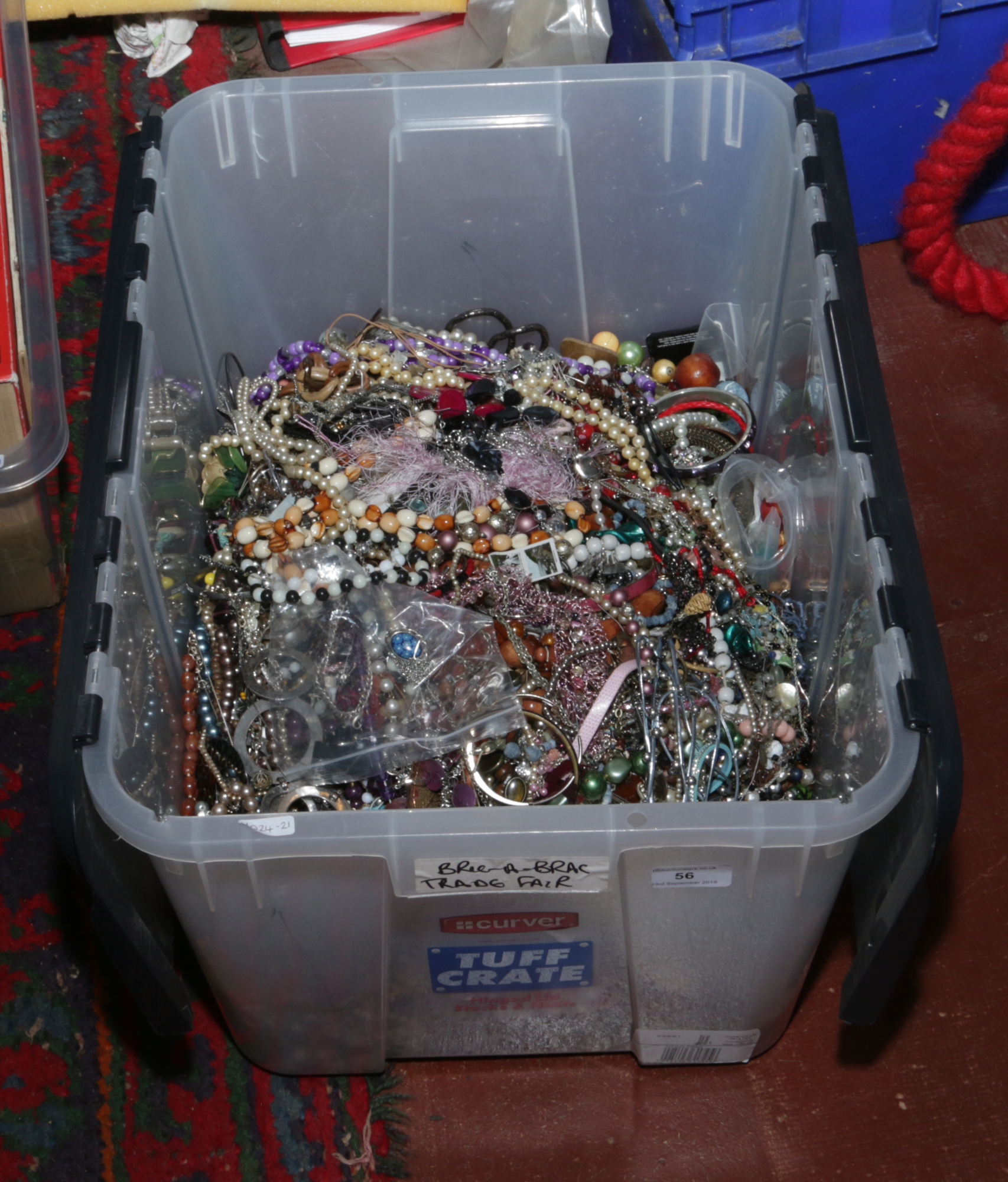 A large box of costume jewellery to include necklaces, beads, bangles etc.