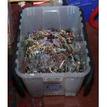 A large box of costume jewellery to include necklaces, beads, bangles etc.