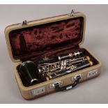 A cased steel ebonite clarinet.