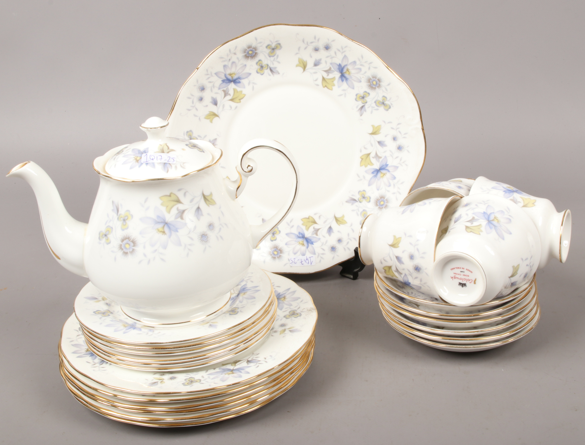 A Colcough bone china part tea set decorated with trailing flowers including tea pot, cups and