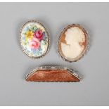 Three silver mounted brooches including gold stone, cameo and porcelain painted with a flower