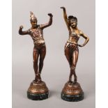 A pair of Art Deco style Spelter figures of dancers, each raised on green marble plinths.