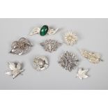 Nine silver and white metal brooches to include silver brooch with large stone setting.