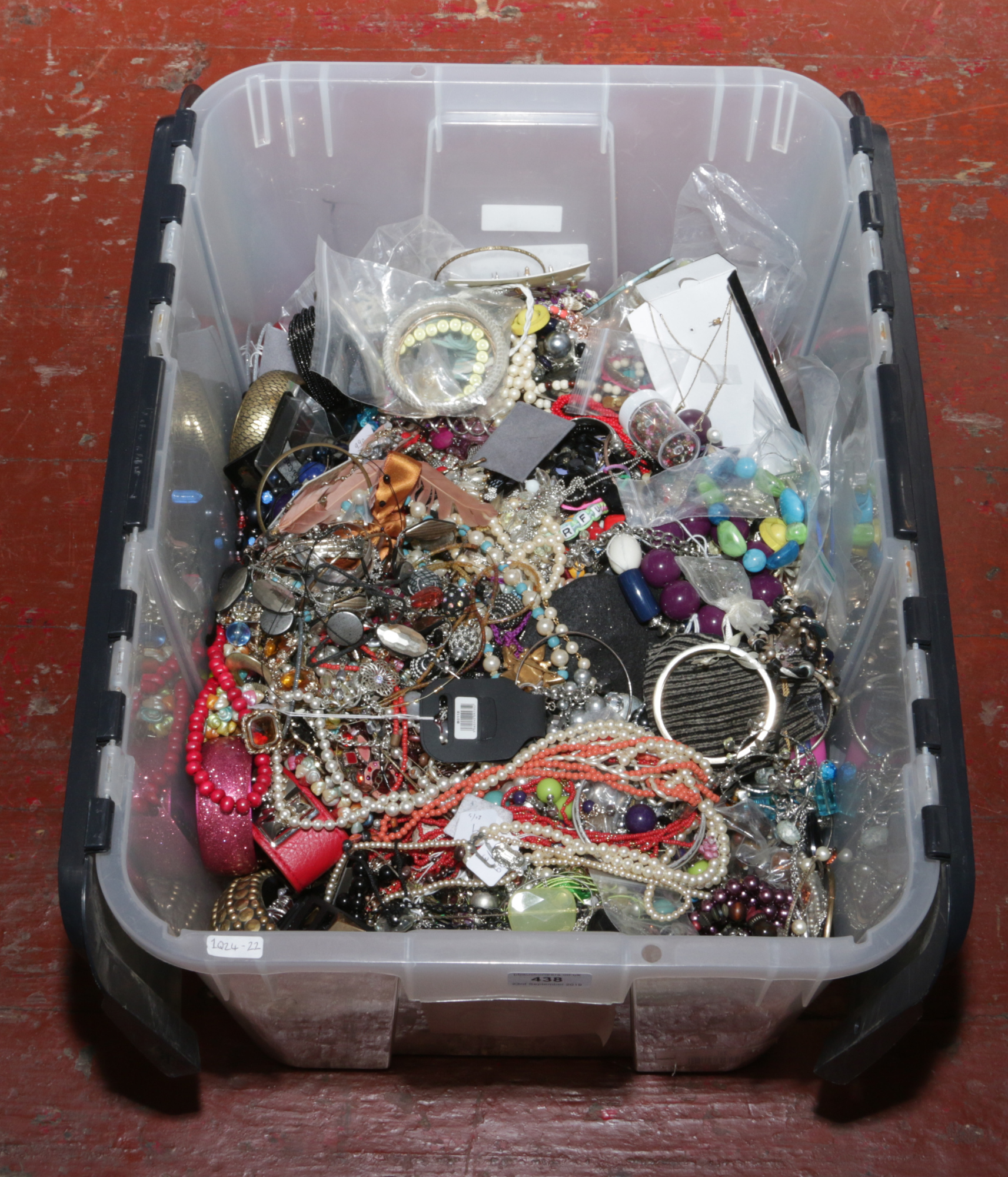 A large box of costume jewellery to include necklaces, beads, bangles etc.