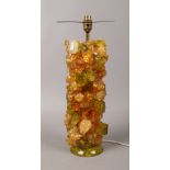 A 1970s table lamp base formed from coloured glass shards.