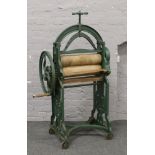 A green painted Victorian cast iron mangle marked New Crown Diamond trade mark by J. R. Sharp &