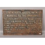 A cast iron London North Eastern Railway wall plaque 'Warning to Trespassers'.