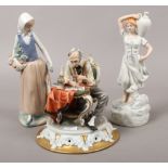 Three ceramic figures to include Royal Dux, Nao and Capodimonte.